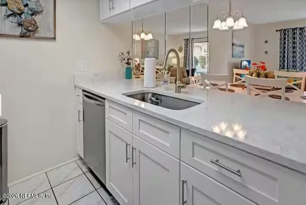 a kitchen with a sink stove and refrigerator
