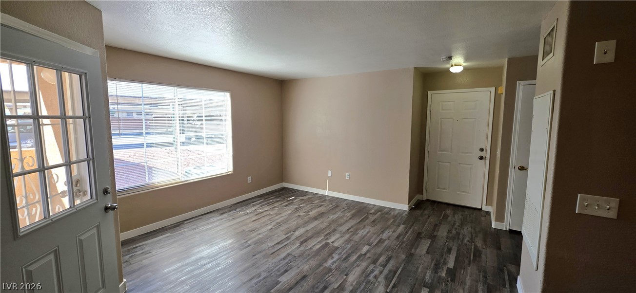 1830 North Pecos Road, Unit 142 Las Vegas, NV 89115 - Photo 3 of 19 An inviting living area welcomes you with wide plank flooring and abundant natural illumination.