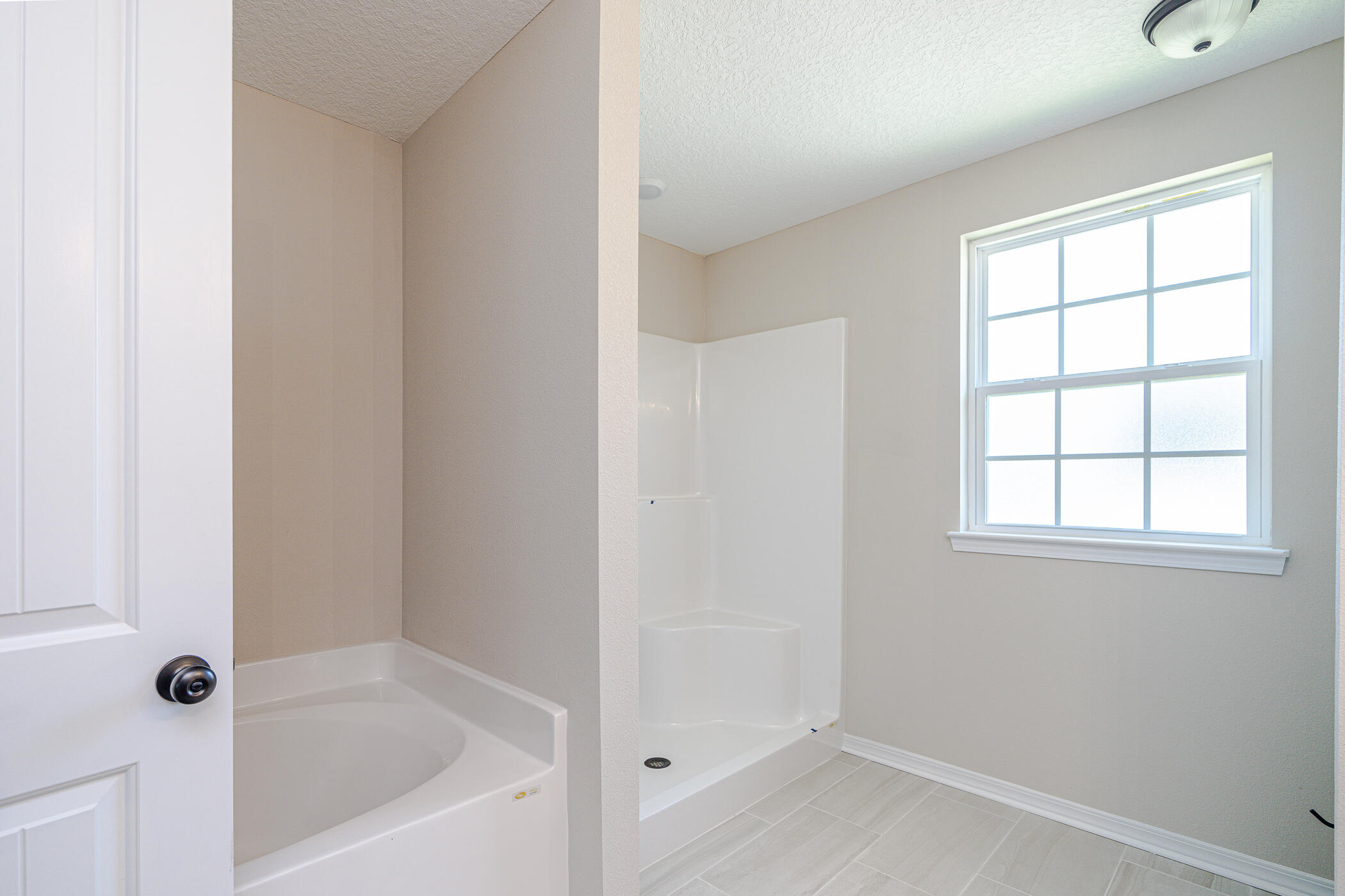 243 Wainwright Drive Crestview, FL 32539 - Photo 23 of 38 a white bath tub sitting next to a window