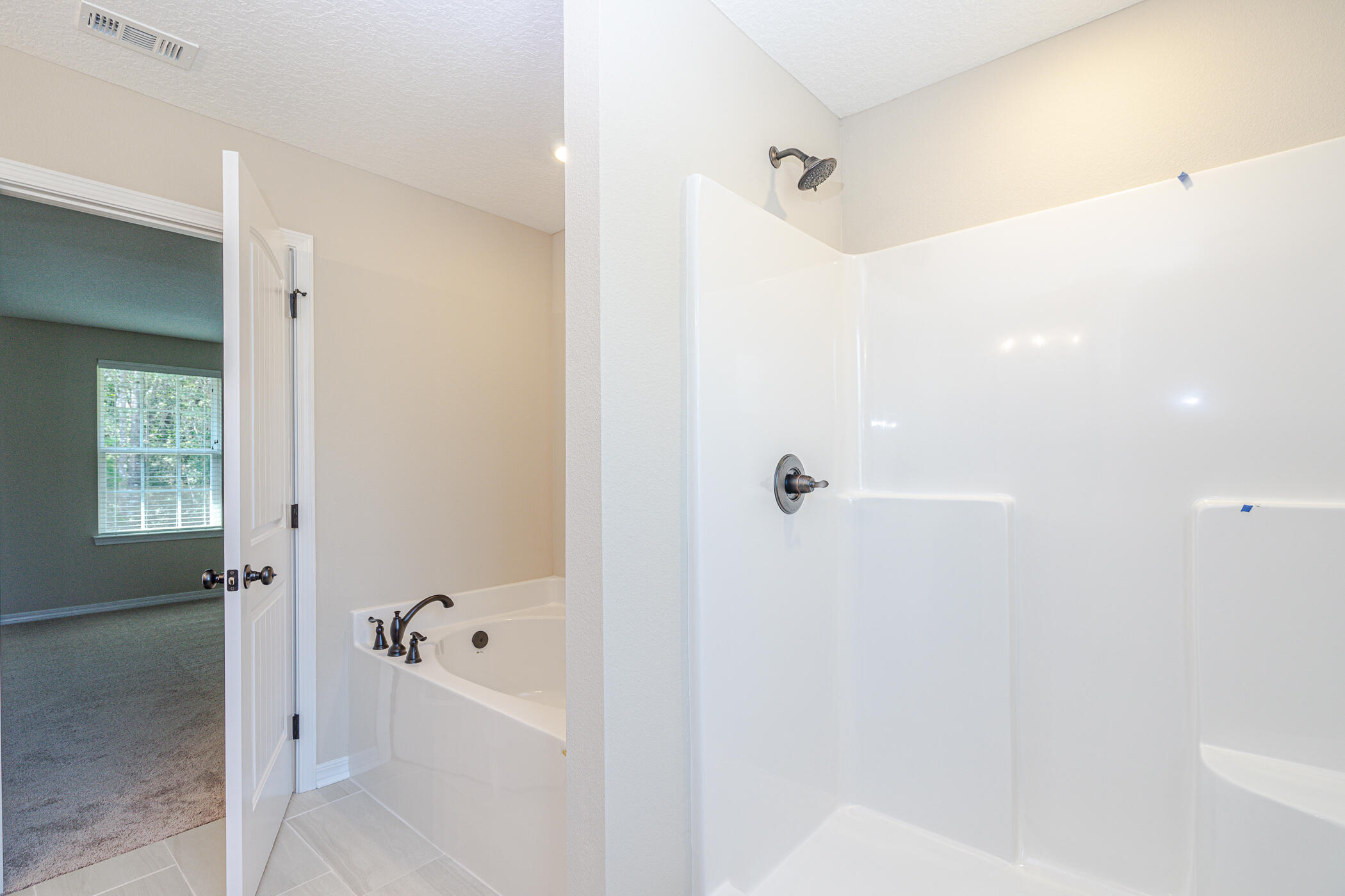 243 Wainwright Drive Crestview, FL 32539 - Photo 24 of 38 a bathroom with a bathtub and shower