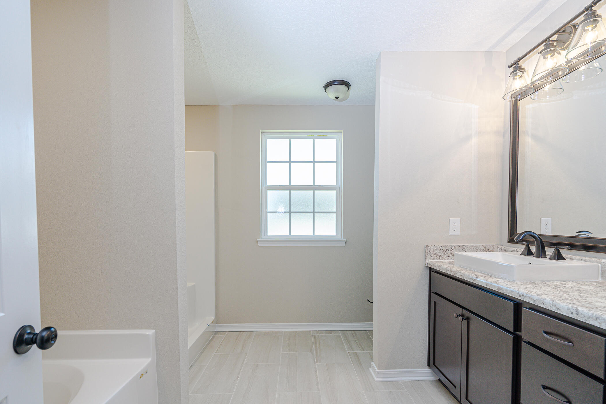 243 Wainwright Drive Crestview, FL 32539 - Photo 25 of 38 a bathroom with a granite countertop sink toilet and shower