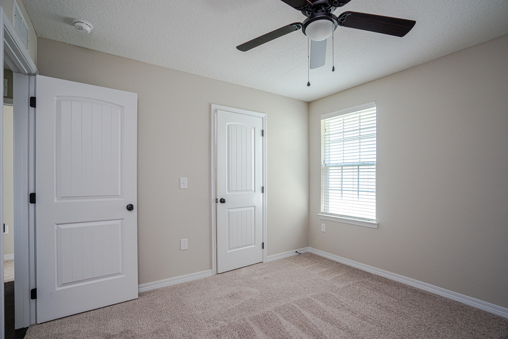 243 Wainwright Drive Crestview, FL 32539 - Photo 32 of 38 a view of an empty room with a window
