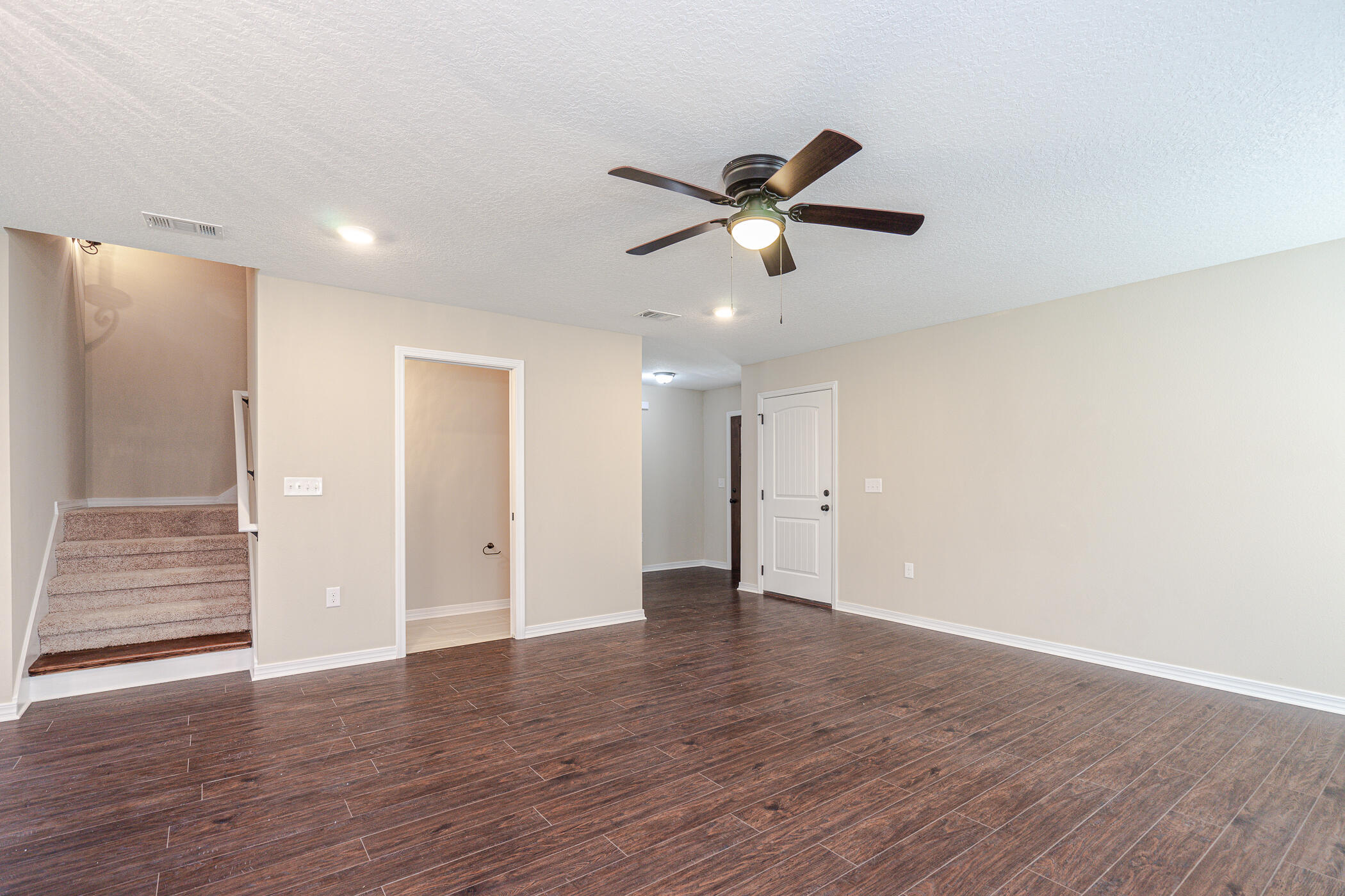 243 Wainwright Drive Crestview, FL 32539 - Photo 9 of 38 a view of an empty room and wooden floor