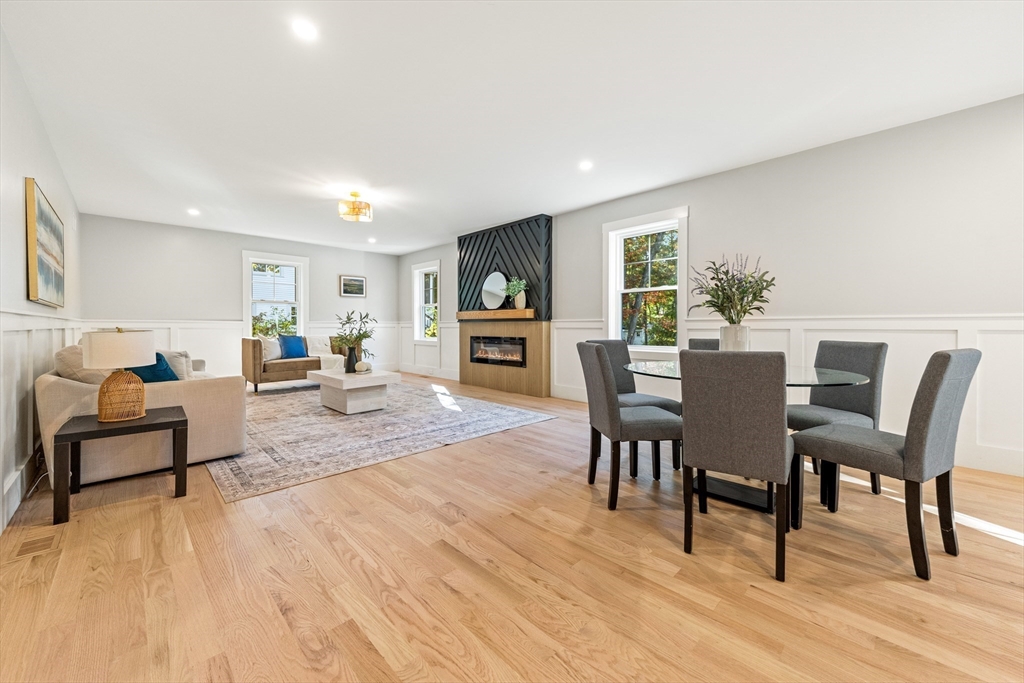 110 Wilson Road Bedford, MA 01730 - Photo 12 of 37 a living room with furniture and a wooden floor