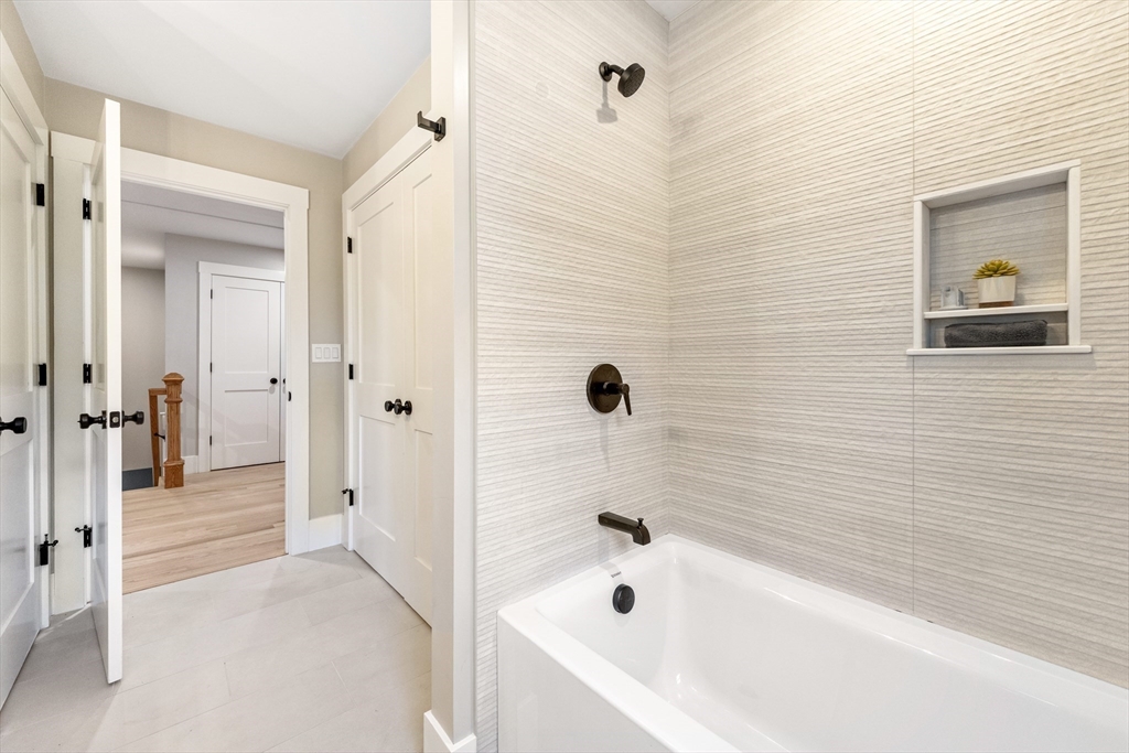 110 Wilson Road Bedford, MA 01730 - Photo 29 of 37 a bathroom with a tub