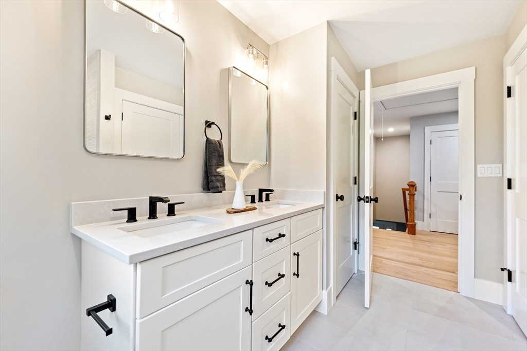 110 Wilson Road Bedford, MA 01730 - Photo 31 of 37 a bathroom with a sink and a mirror