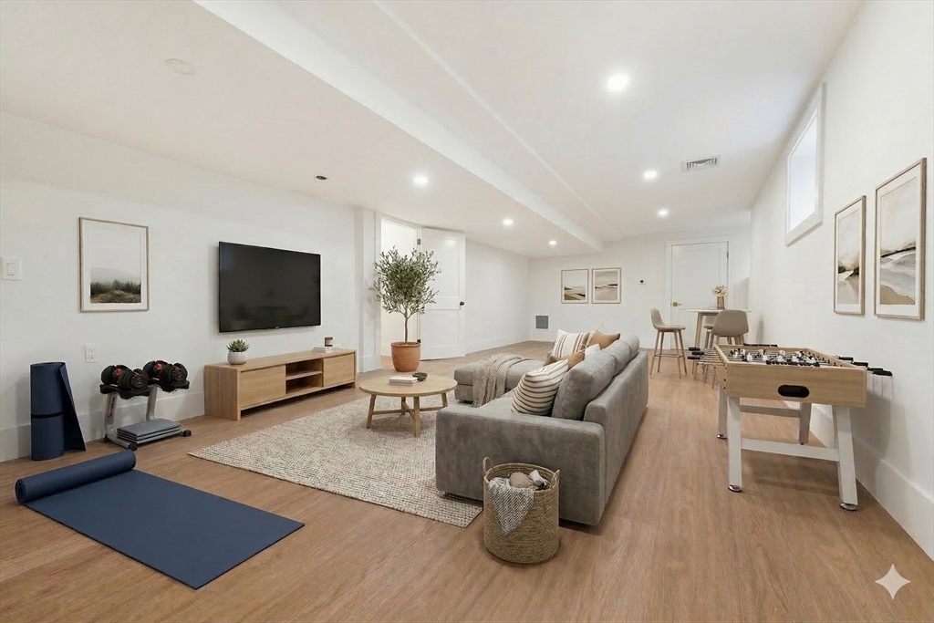 110 Wilson Road Bedford, MA 01730 - Photo 32 of 37 a living room with furniture and a flat screen tv