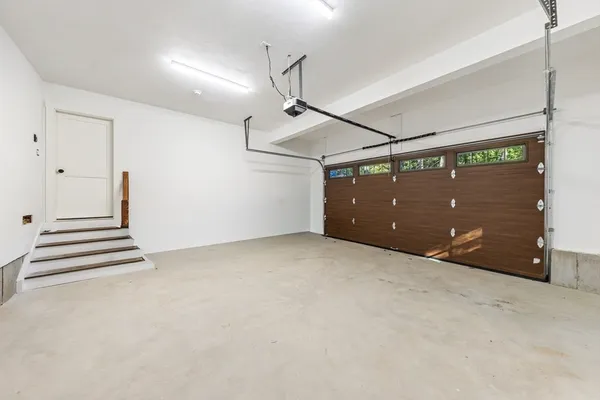 a view of a room with stairs and a ceiling fan