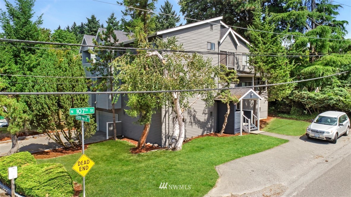 1300 North 107th Street Seattle, WA 98133 - Photo 2 of 20 a view of a backyard with plants and a patio