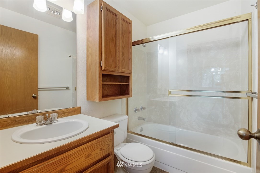 1300 North 107th Street Seattle, WA 98133 - Photo 20 of 20 a bathroom with a sink toilet and shower