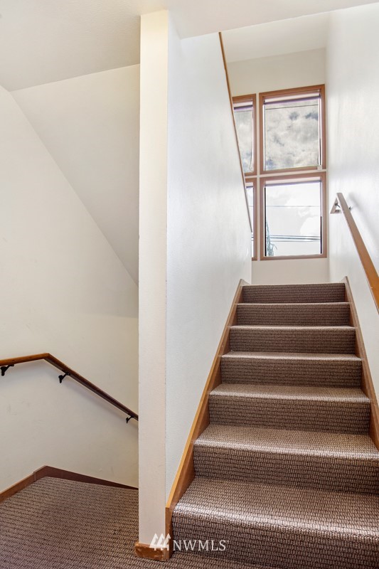 1300 North 107th Street Seattle, WA 98133 - Photo 7 of 20 a view of staircase with white walls and a window