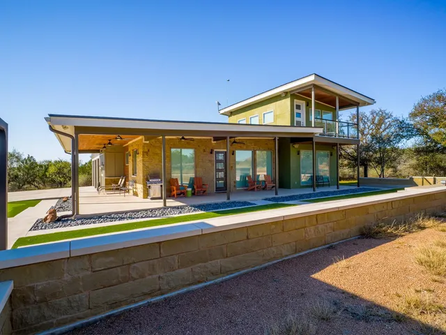 a view of house with a swimming pool