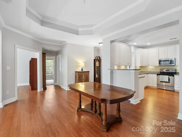 a living room with fireplace furniture and a wooden floor