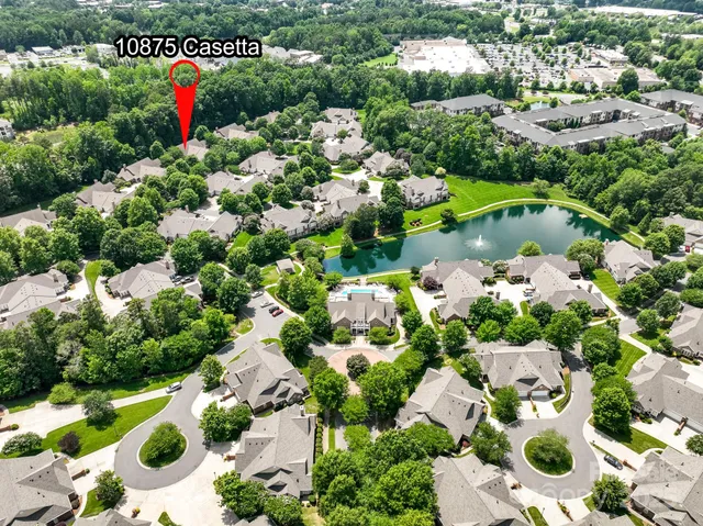 an aerial view of a houses with a yard
