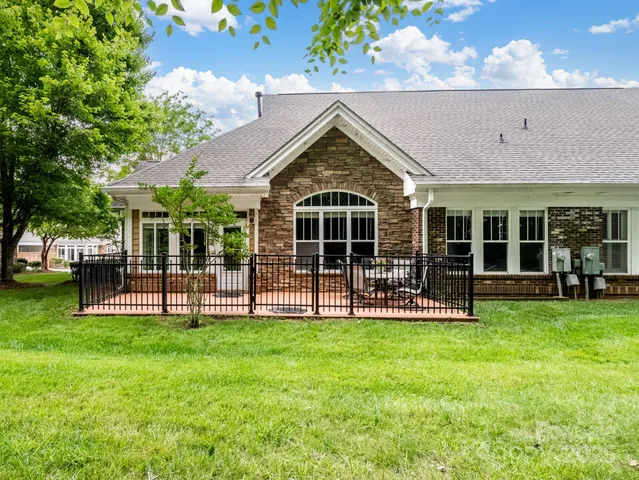 a view of outdoor space with a garden and trees