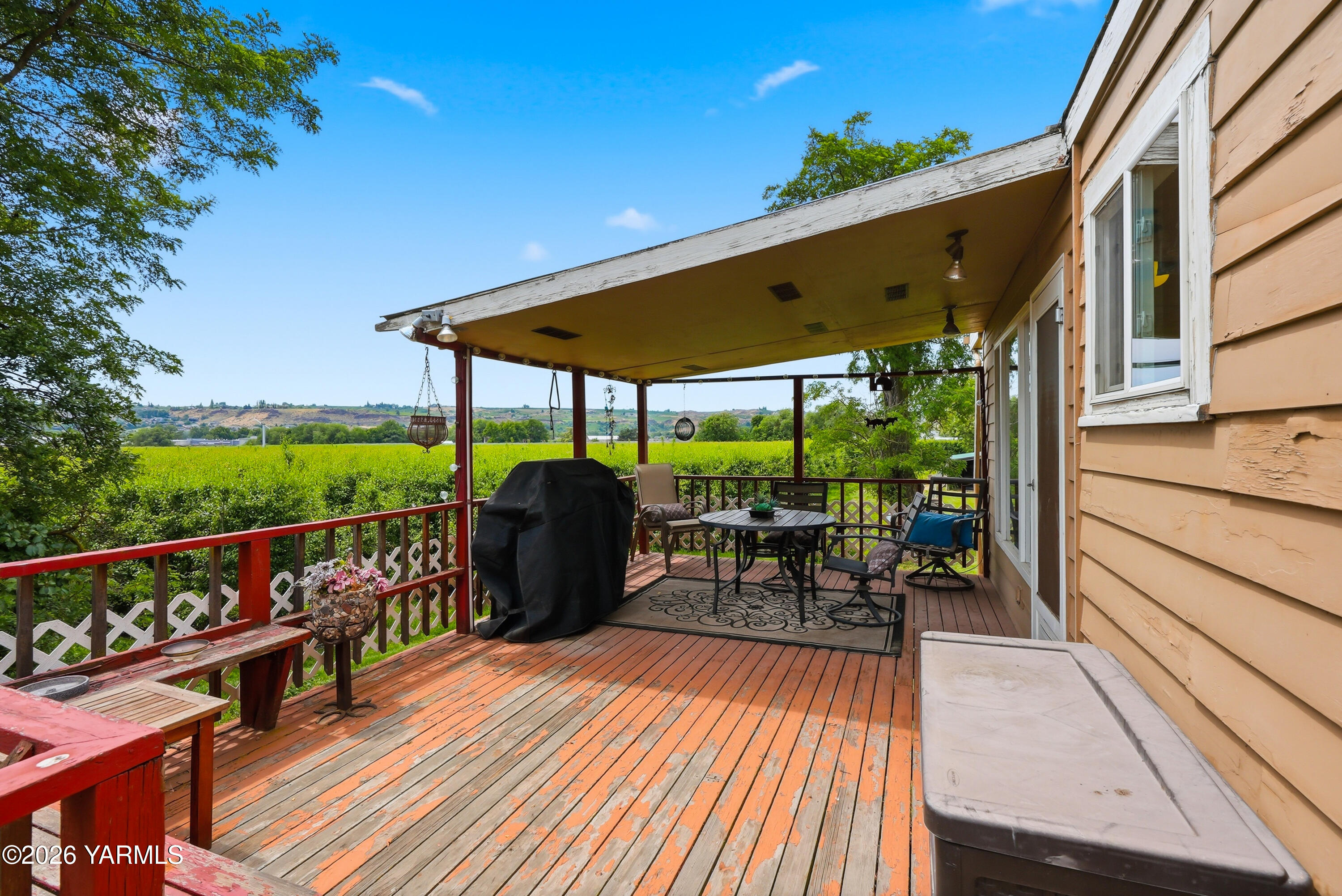 690 North Gleed Road Naches, WA 98937 - Photo 41 of 60 a view of a chairs and table on the wooden deck
