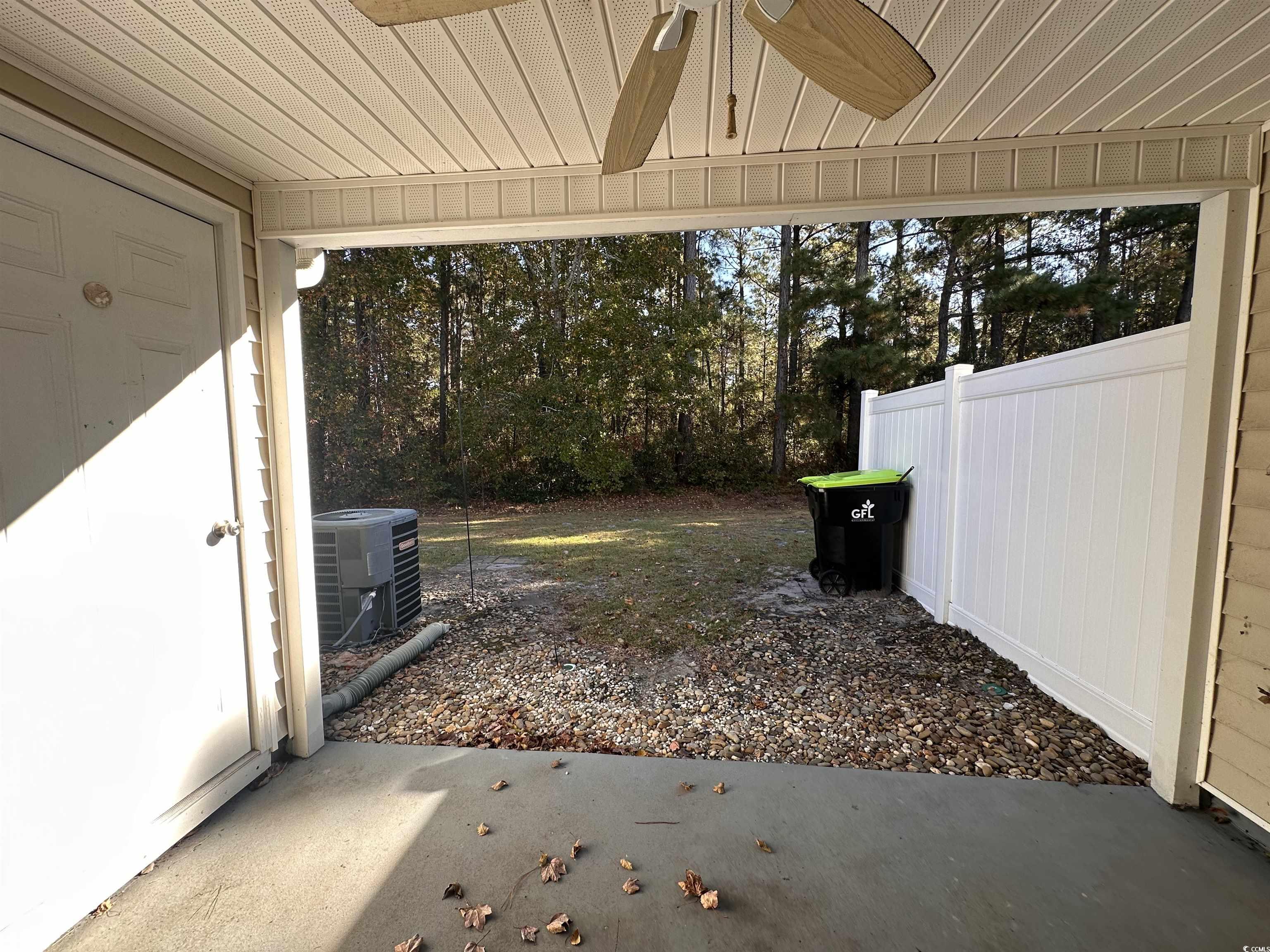 257 Seabert Road Myrtle Beach, SC 29579 - Photo 14 of 16 View of yard with a patio and ceiling fan