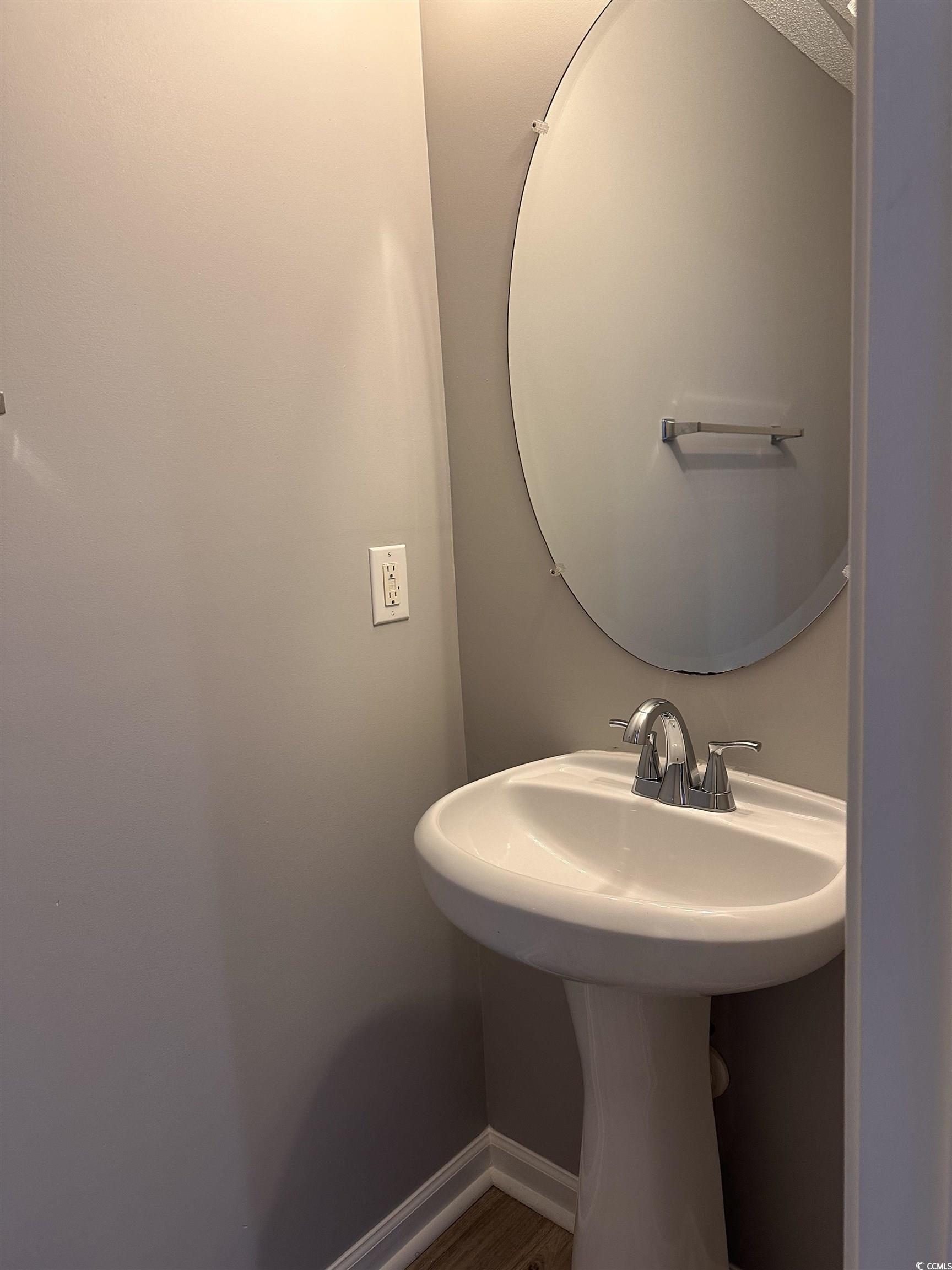 257 Seabert Road Myrtle Beach, SC 29579 - Photo 6 of 16 Bathroom with baseboards and a sink