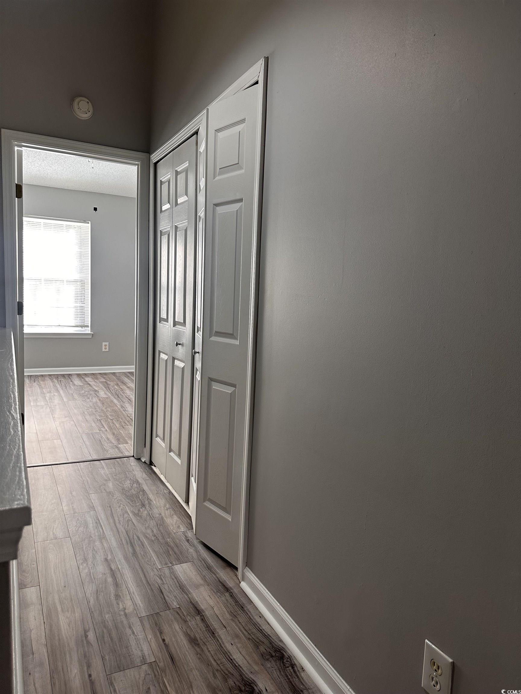 257 Seabert Road Myrtle Beach, SC 29579 - Photo 9 of 16 Hall featuring baseboards and wood finished floors