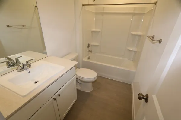a bathroom with a sink a toilet and a bathtub