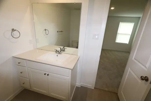 a bathroom with a sink a vanity and a mirror