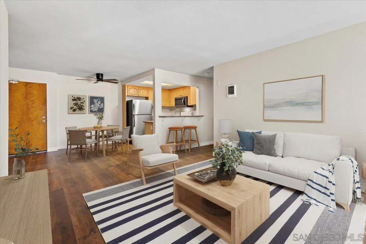 a living room with fireplace furniture and a table