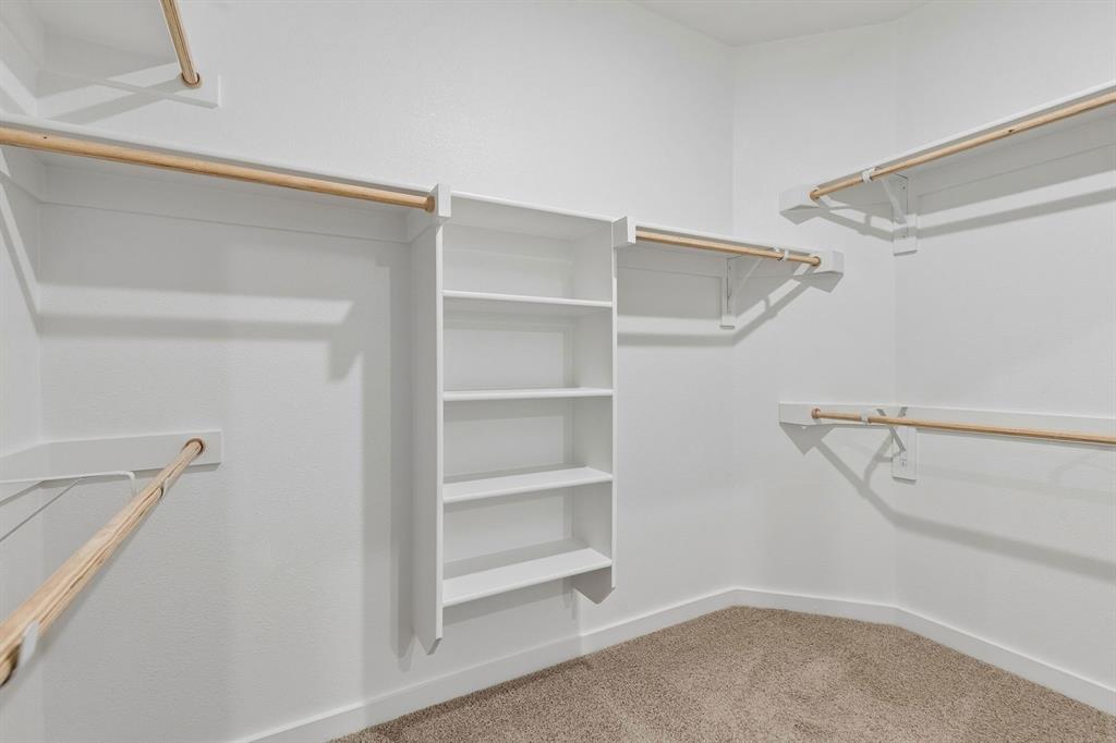 1124 Del Rio Drive Lavon, TX 75166 - Photo 21 of 32 Primary Closet in the Emmy II home plan by Trophy Signature Homes - REPRESENTATIVE PHOTO