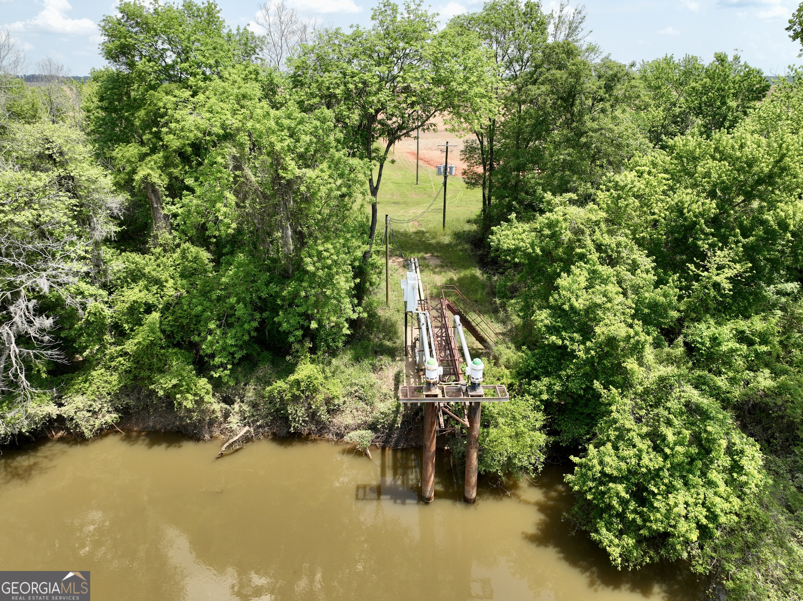89 Griffin Road Hawkinsville, GA 31036 - Photo 18 of 48 an aerial view of a house with a yard and lake view