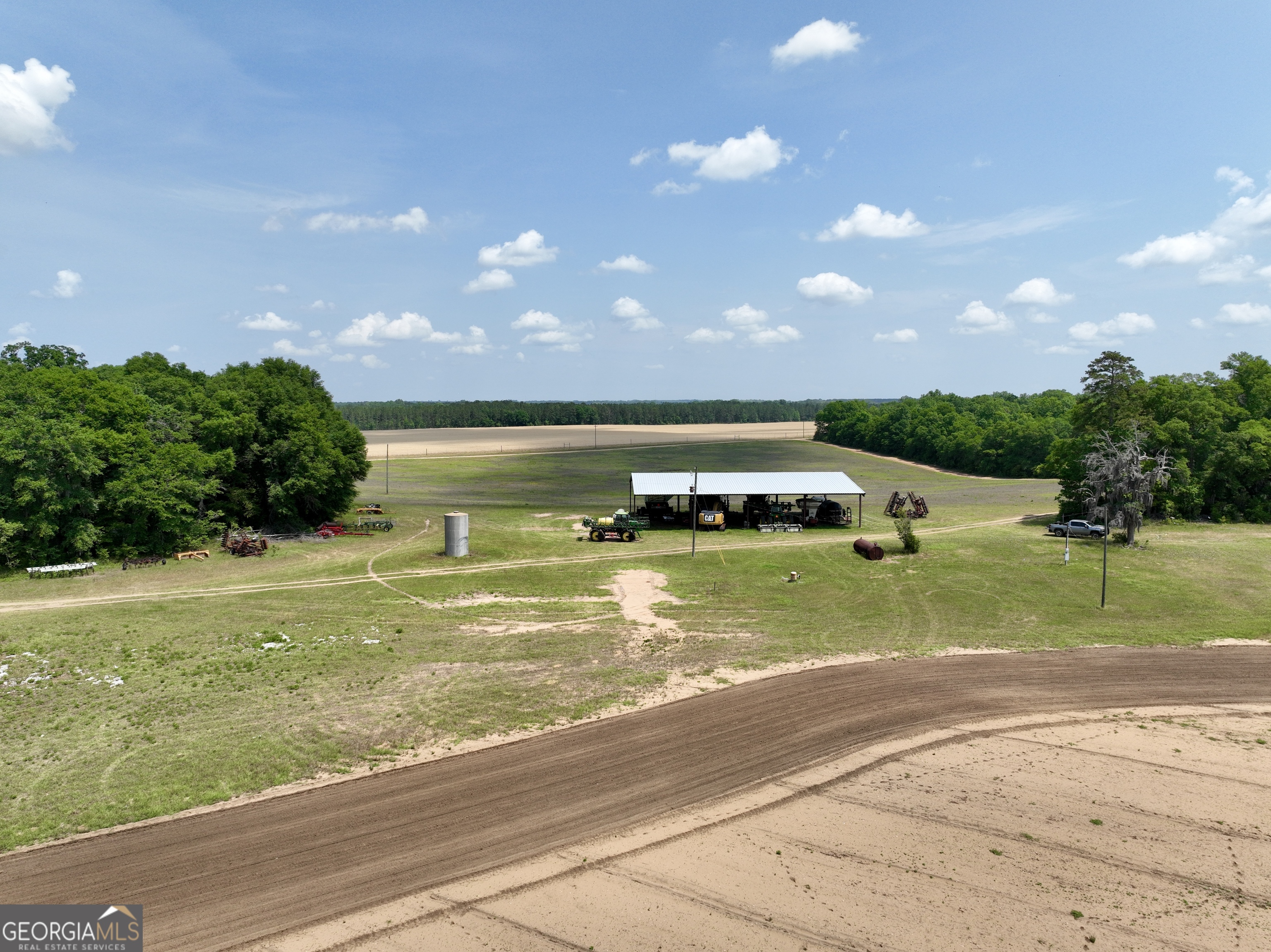 89 Griffin Road Hawkinsville, GA 31036 - Photo 23 of 48 a view of an swimming pool and an outdoor seating