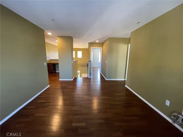 a bathroom with a granite countertop sink a mirror and a bathtub