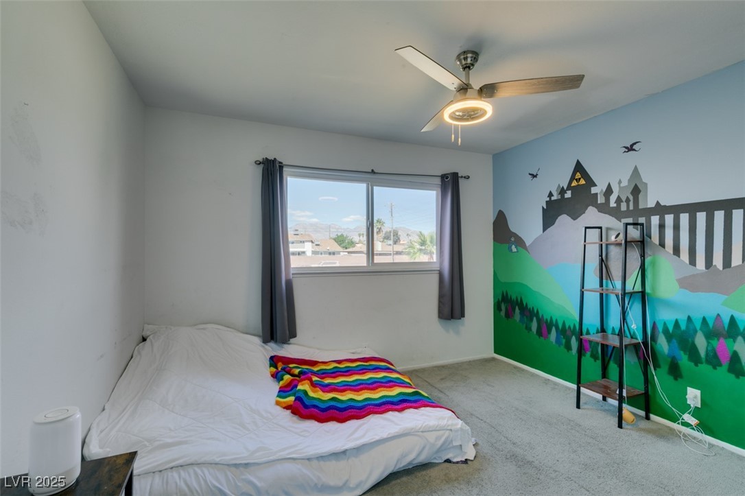100 Huntly Road Las Vegas, NV 89145 - Photo 12 of 16 Carpeted bedroom with a ceiling fan