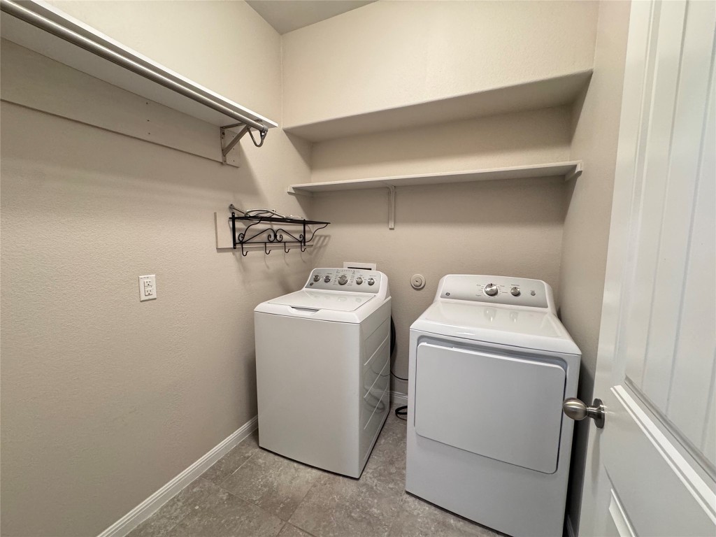 16420 Pienza Drive Pflugerville, TX 78660 - Photo 12 of 26 Laundry room with baseboards and independent washer and dryer