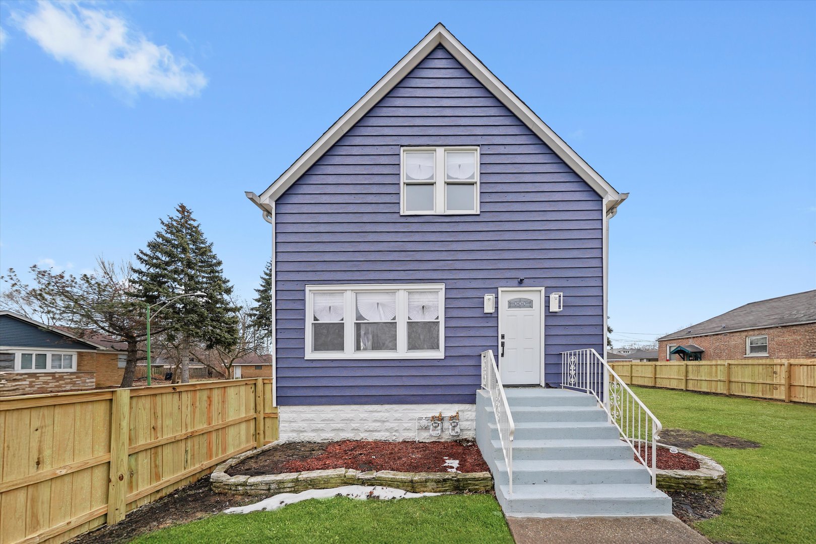 a view of a house with a yard