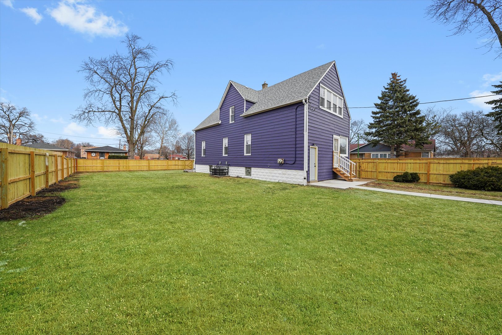 721 West 116th Street Chicago, IL 60628 - Photo 5 of 11 a view of a house with a yard