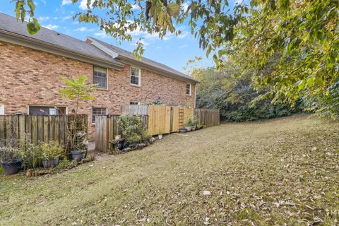a view of a backyard of the house