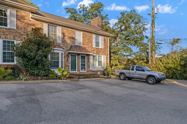 a view of a car parked in front of a building