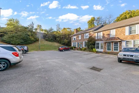 a view of street with parked cars