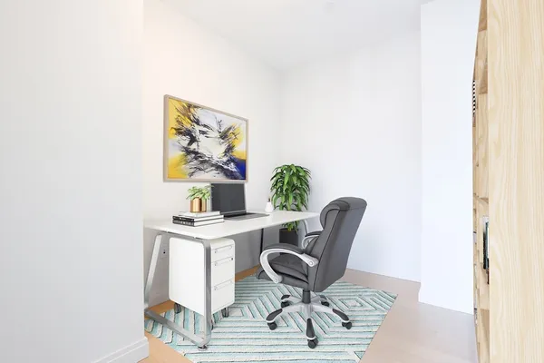 a workspace with furniture and wooden floor