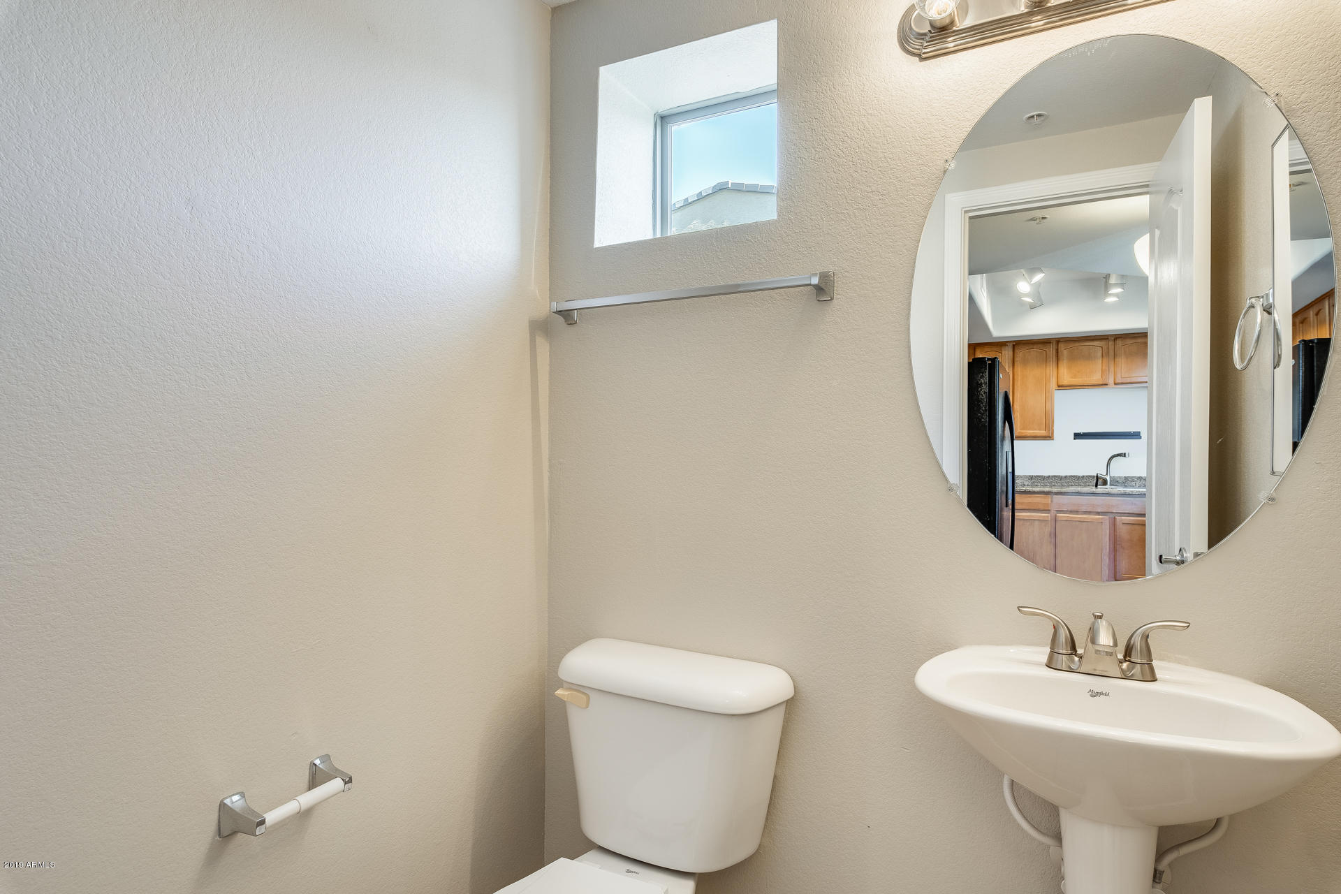 2401 East Rio Salado Parkway, Unit 1124 Tempe, AZ 85288 - Photo 14 of 32 a bathroom with a toilet sink and mirror