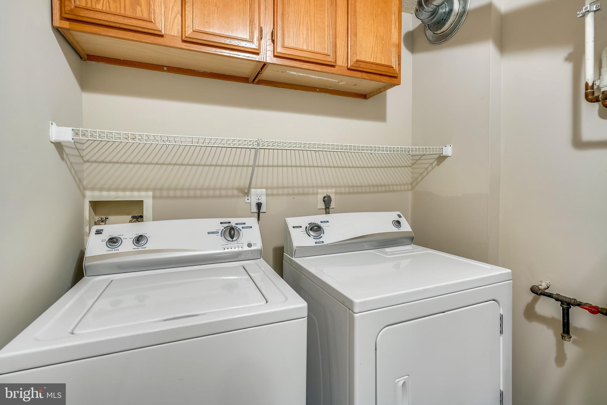 2408 Forest Edge Court, Unit 303 Odenton, MD 21113 - Photo 20 of 46 a utility room with dryer and washer