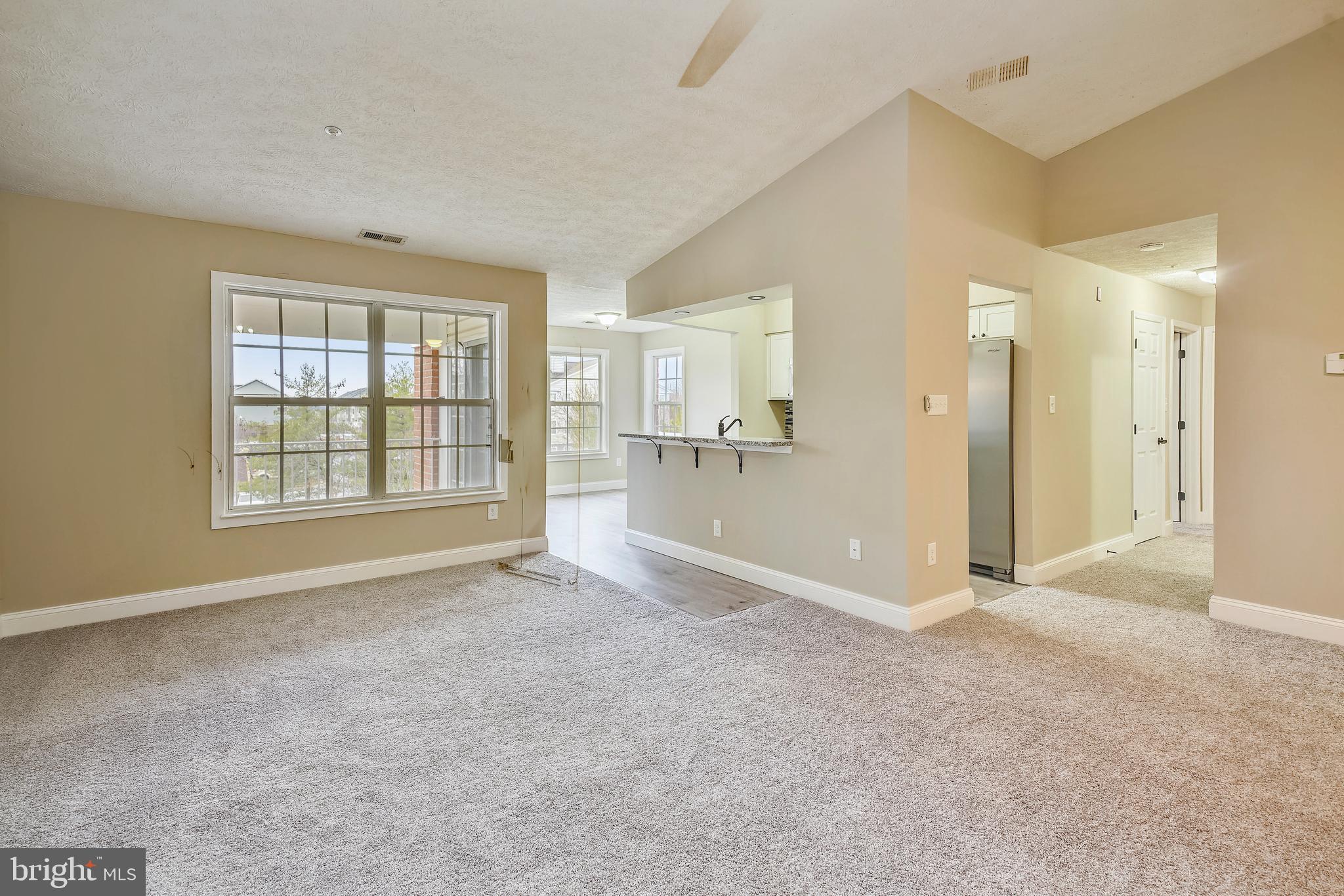 2408 Forest Edge Court, Unit 303 Odenton, MD 21113 - Photo 2 of 46 a view of an empty room with a window