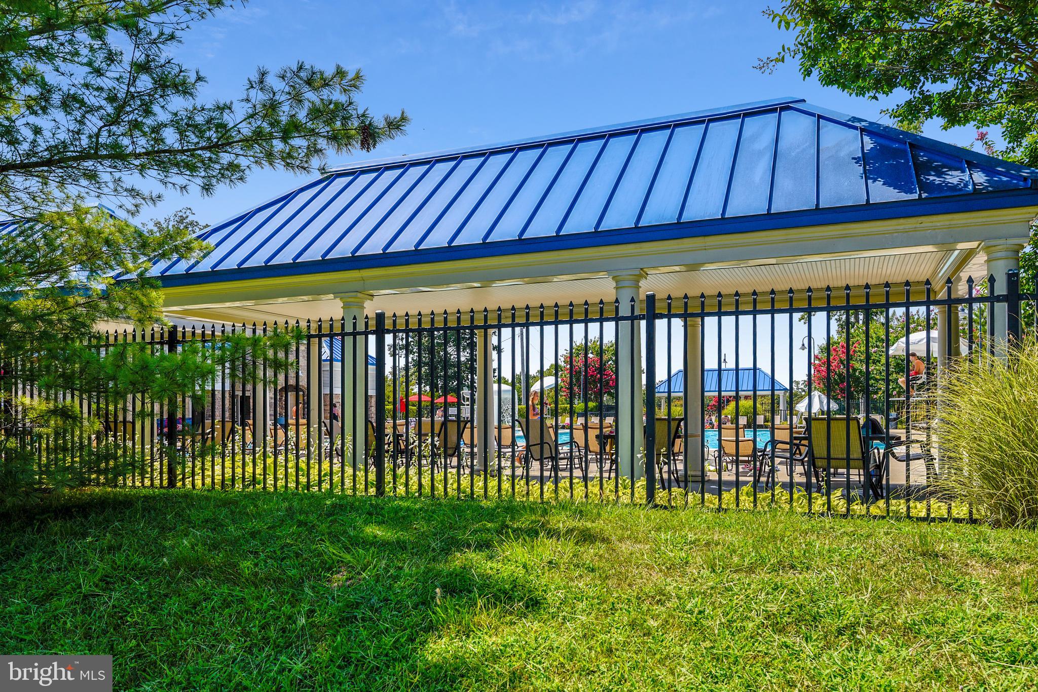 2408 Forest Edge Court, Unit 303 Odenton, MD 21113 - Photo 24 of 46 a view of a backyard with a garden