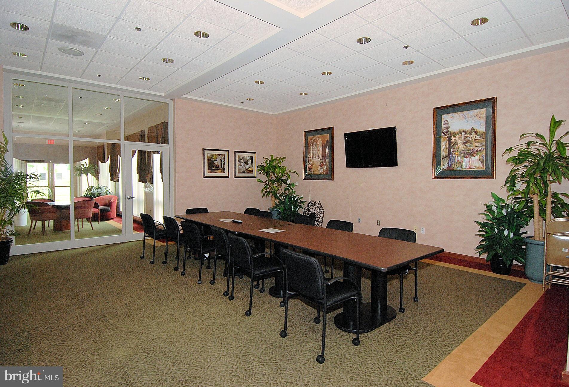 2408 Forest Edge Court, Unit 303 Odenton, MD 21113 - Photo 33 of 46 a view of a livingroom with furniture
