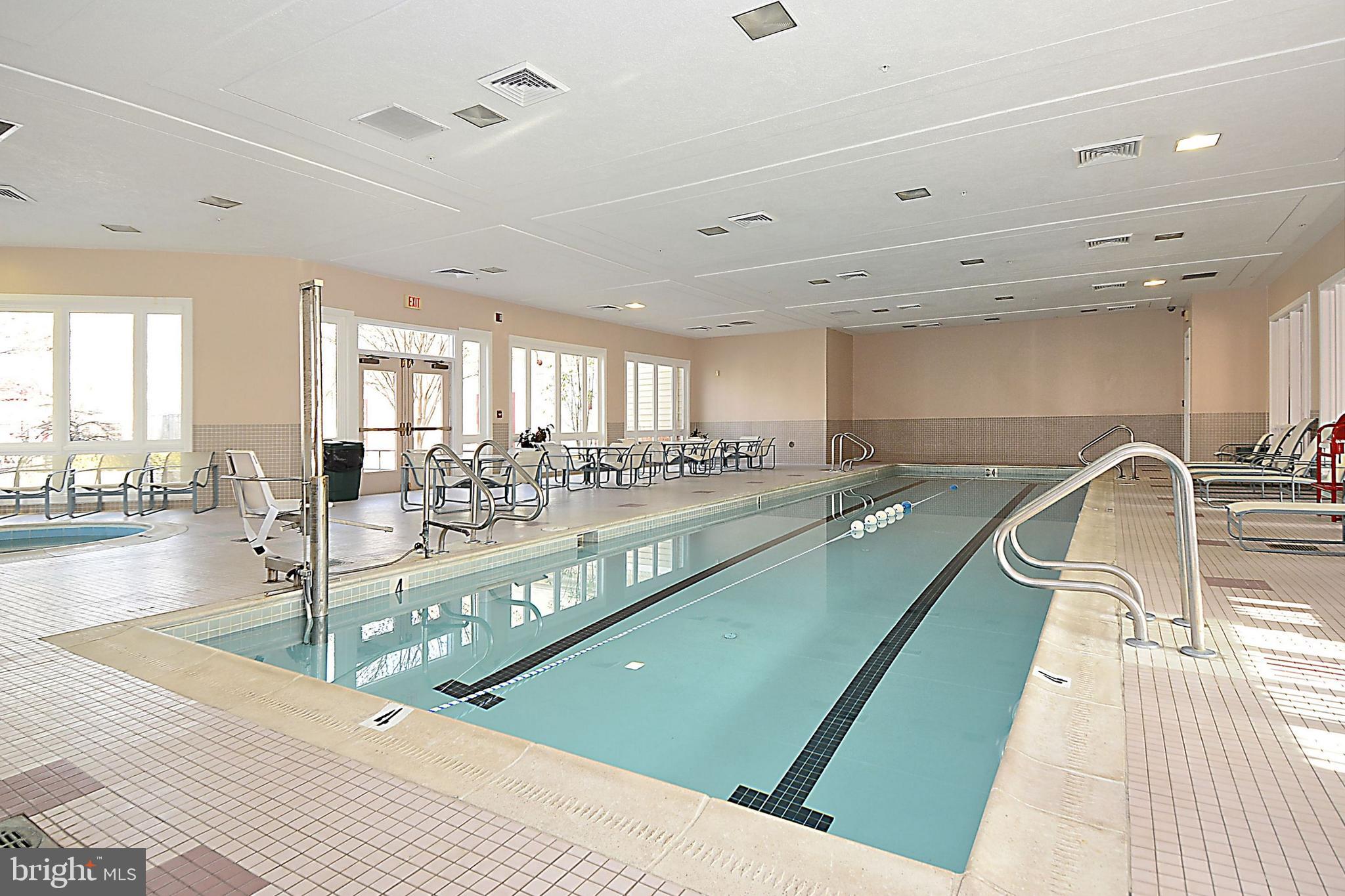 2408 Forest Edge Court, Unit 303 Odenton, MD 21113 - Photo 37 of 46 a view of a living room and kitchen