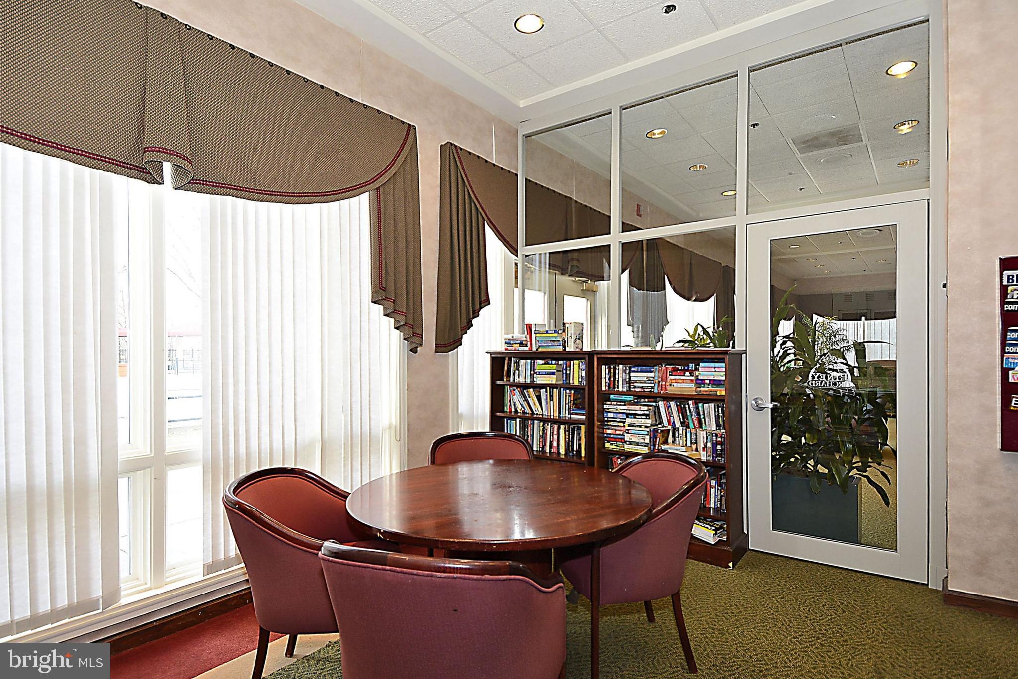 2408 Forest Edge Court, Unit 303 Odenton, MD 21113 - Photo 40 of 46 a dining room with furniture and window