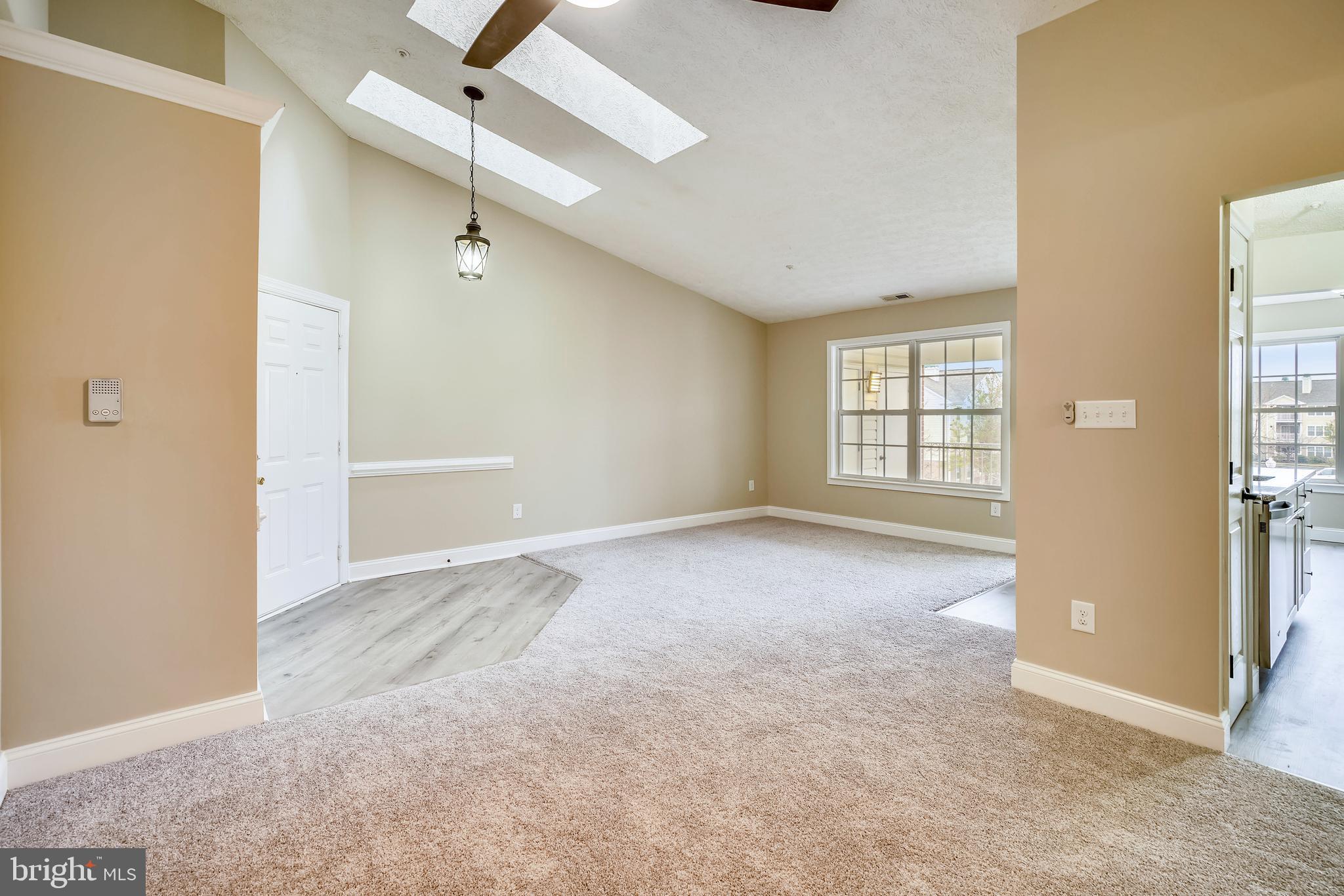 2408 Forest Edge Court, Unit 303 Odenton, MD 21113 - Photo 4 of 46 an empty room with windows and closet