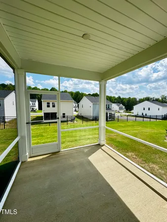 a large tree in front of a house