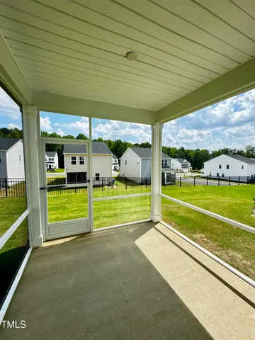 a large tree in front of a house