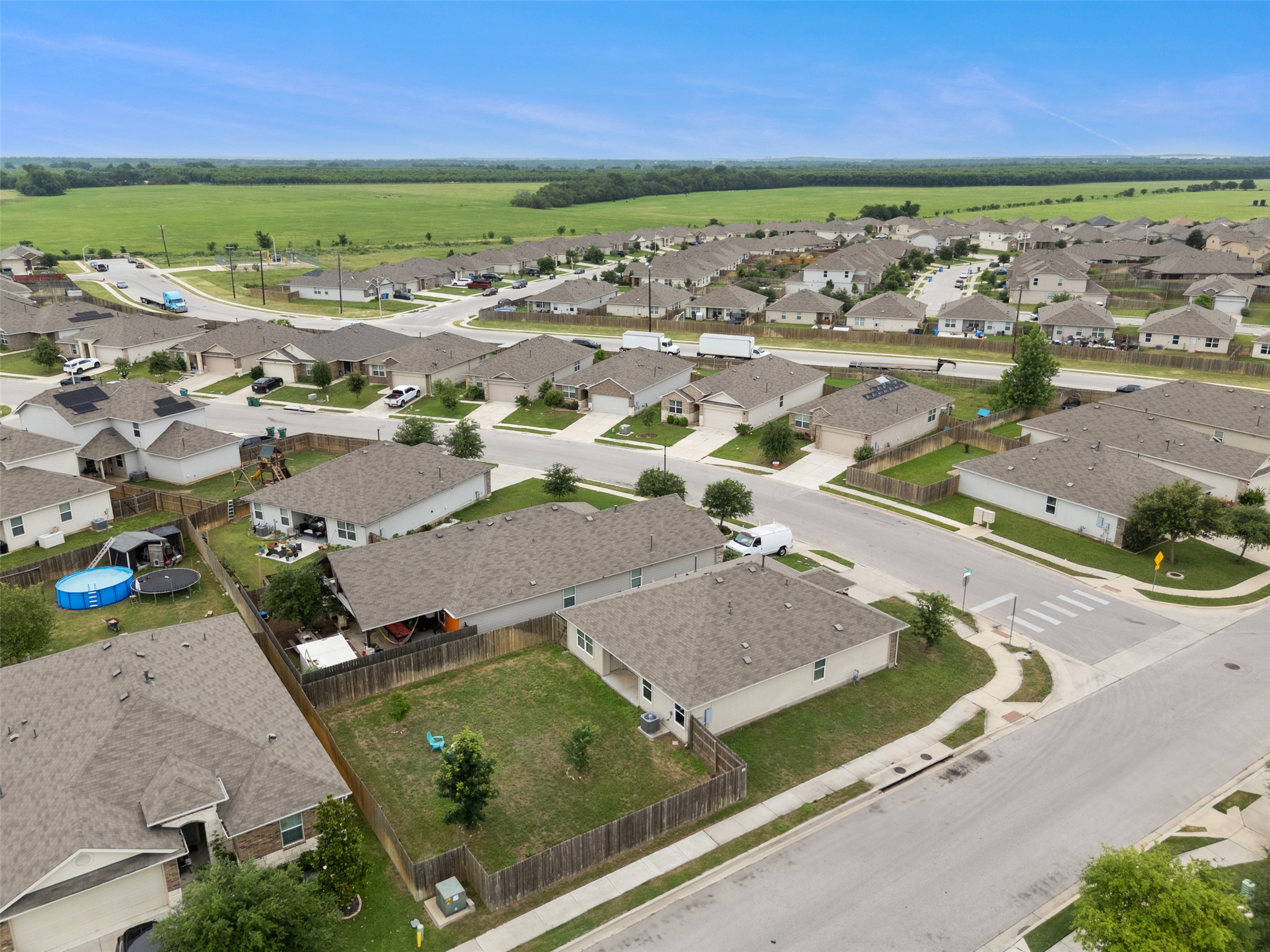 14900 Retha Pass Austin, TX 78725 - Photo 39 of 39 Aerial perspective of a residential neighborhood featuring single-story homes with shingle roofs