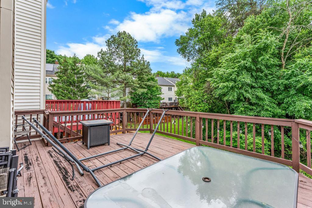 11409 Hermosa Drive Laurel, MD 20708 - Photo 14 of 28 a view of balcony with wooden floor and fence